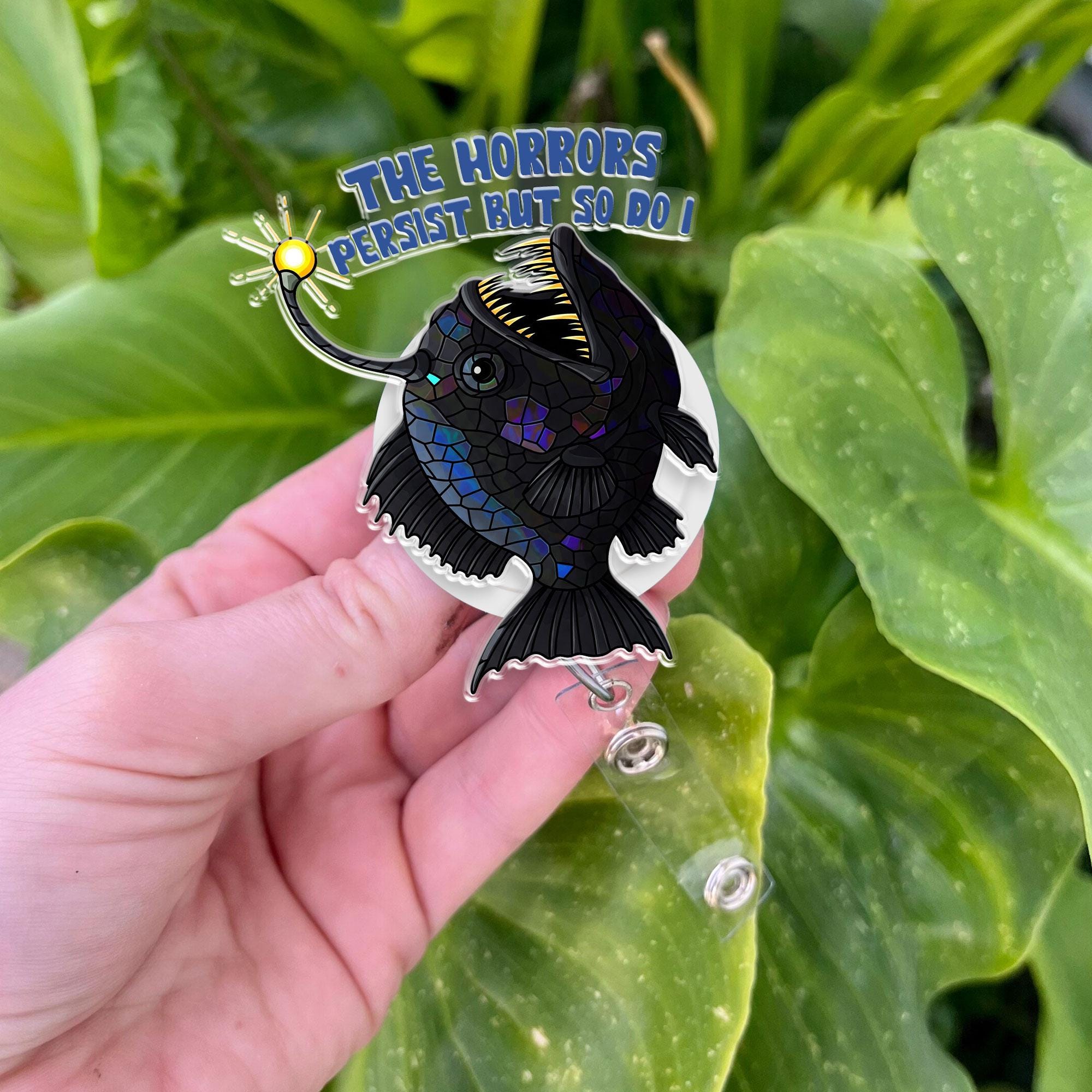 Anglerfish Horrors Persist But So Do I Badge Reel, Black Sead evil Fishing Gen z inspired, She Rises, deep sea fish badge reel