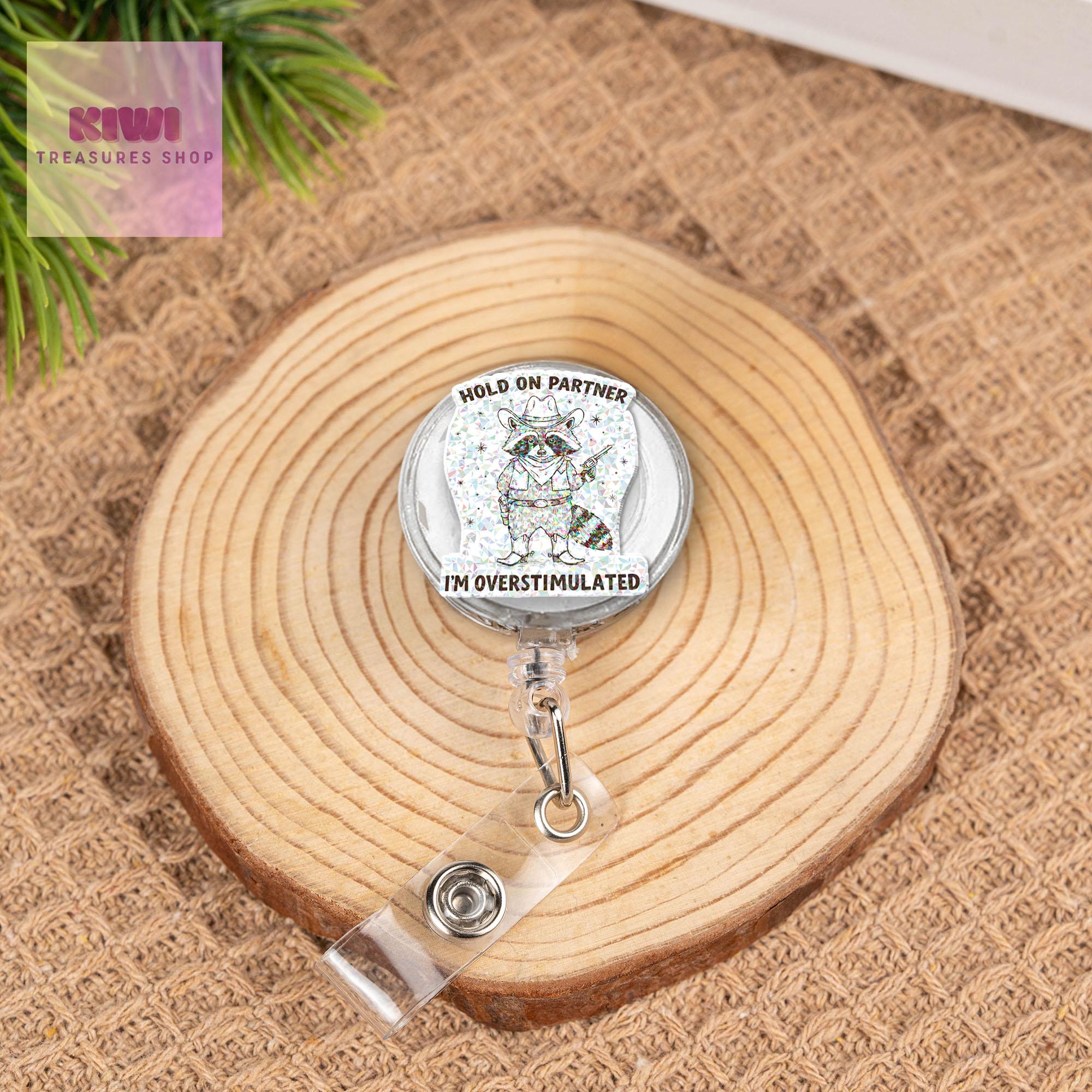 Hold on partner I'm overstimulated Badge reel, Funny cowboy raccoon nurse ID holder for nurse gifts and fun accessories, western cowboy