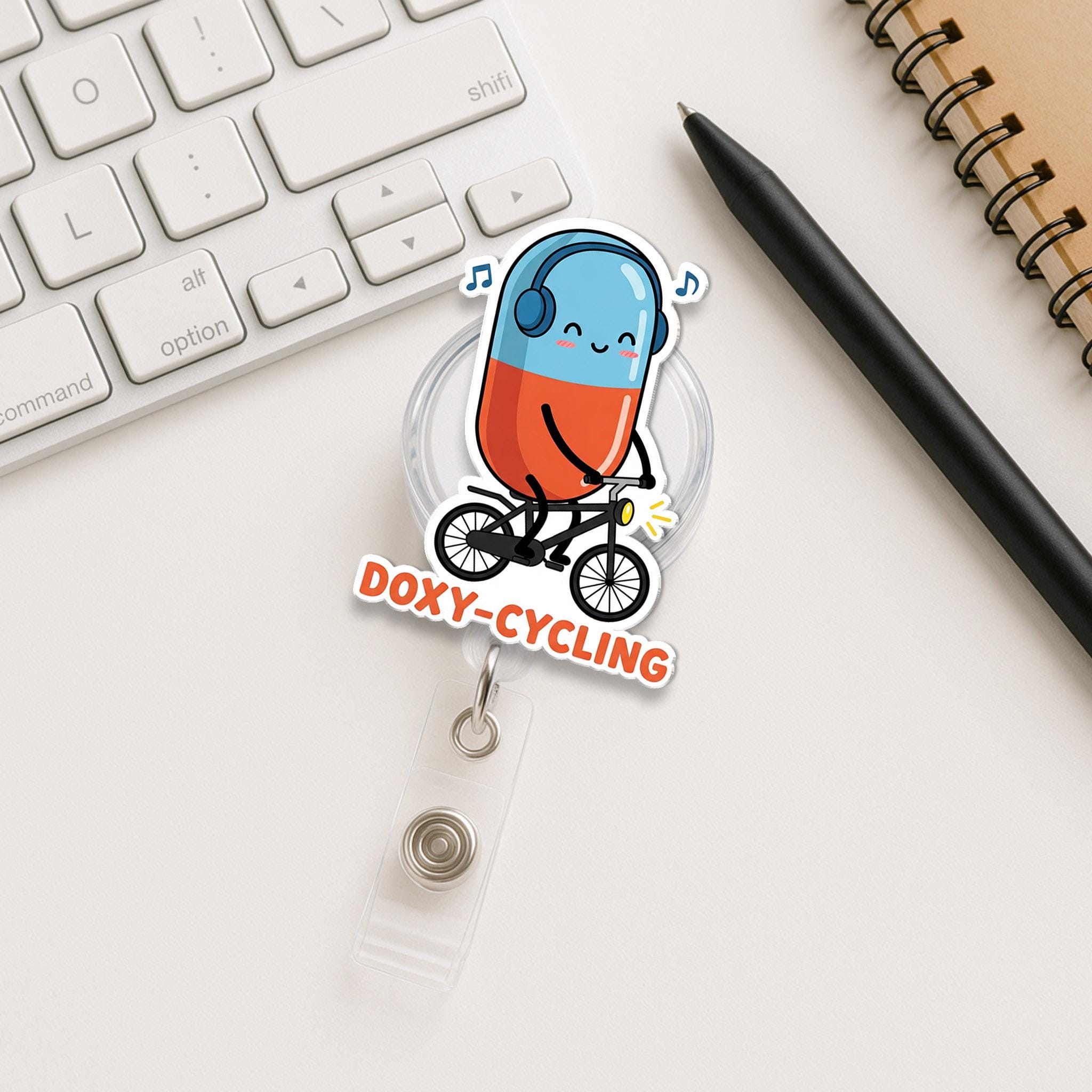 Doxy-Cycling Badge Reel, Funny Pill on Bike ID Clip, Pharmacist Nurse Gift, Cute Medical Pun Badge, Cycling Medicine Reel