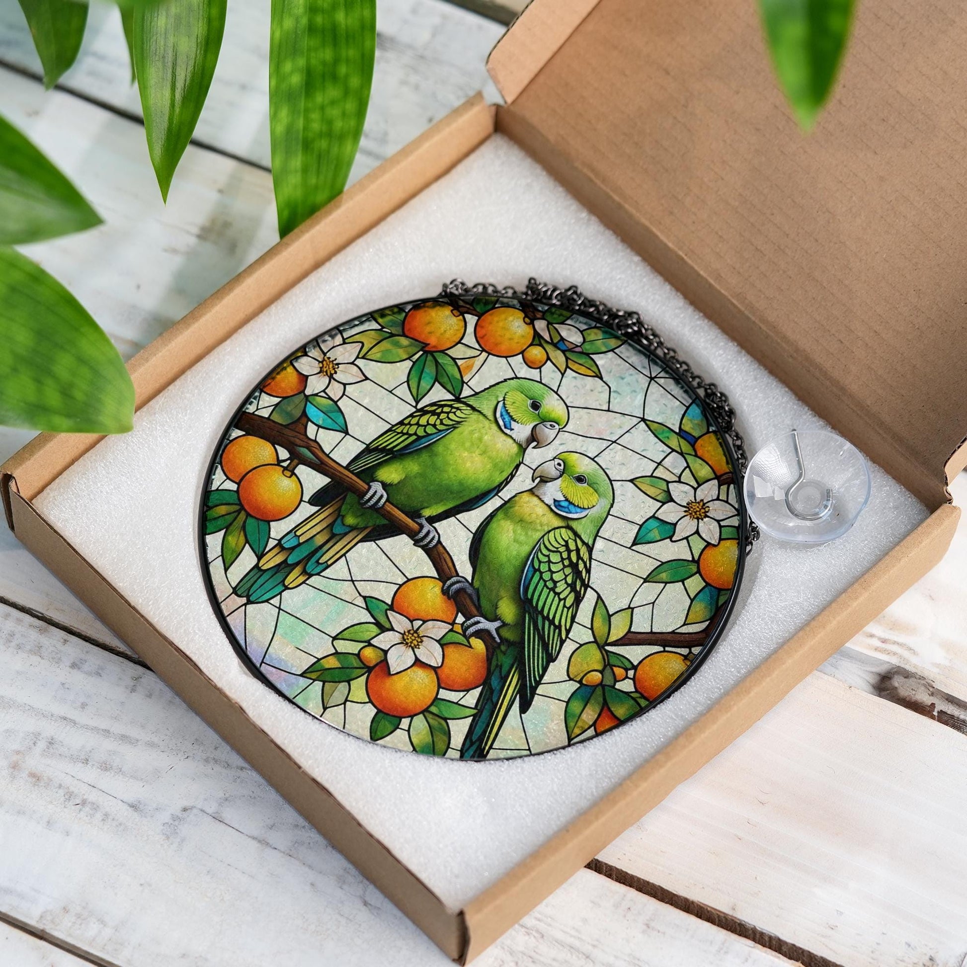 Vibrant Parrot Glass Suncatcher with Lush Orange Tree Design, Handcrafted Window Hanging Art for Bird Lovers and Home Decor Enthusiasts