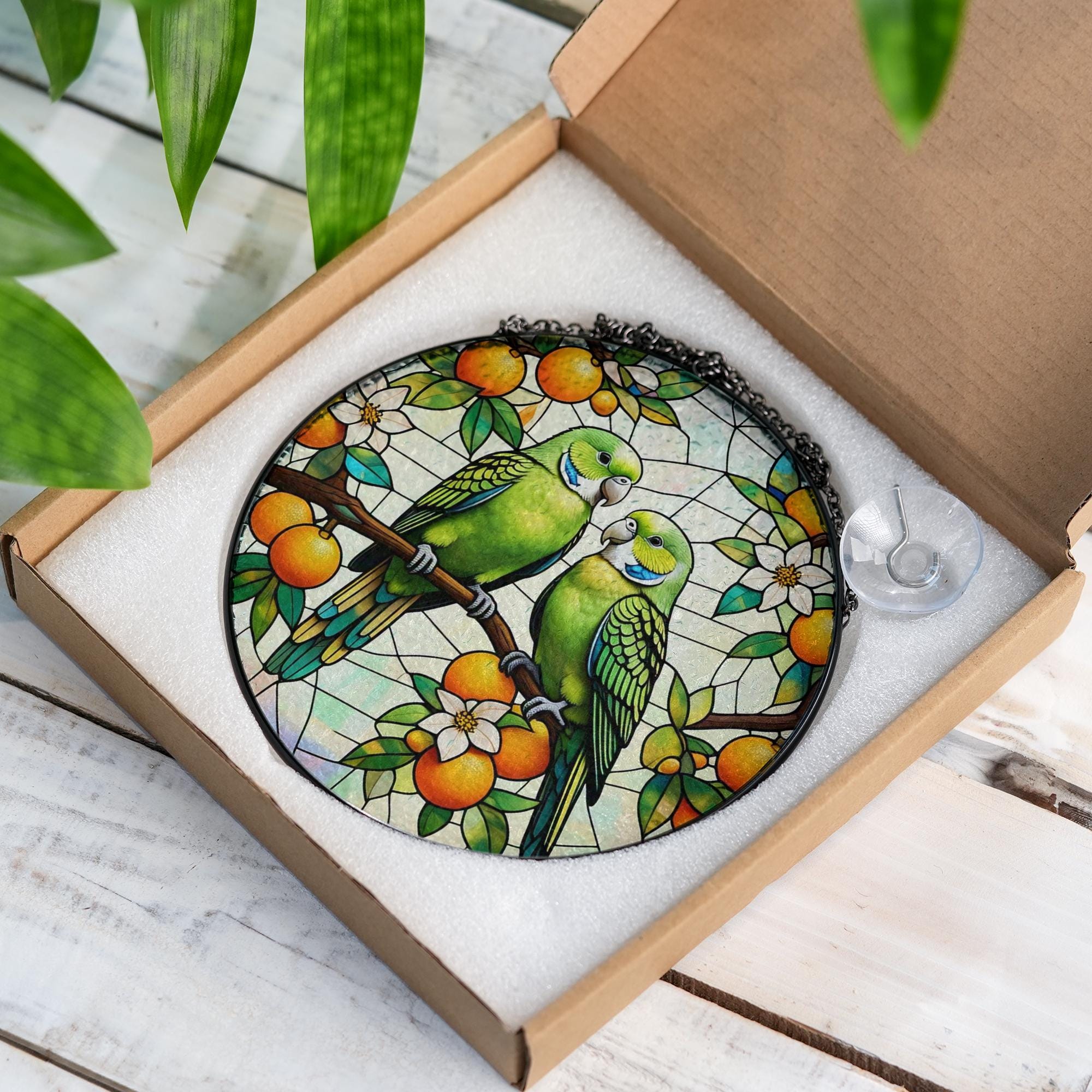 Vibrant Parrot Glass Suncatcher with Lush Orange Tree Design, Handcrafted Window Hanging Art for Bird Lovers and Home Decor Enthusiasts