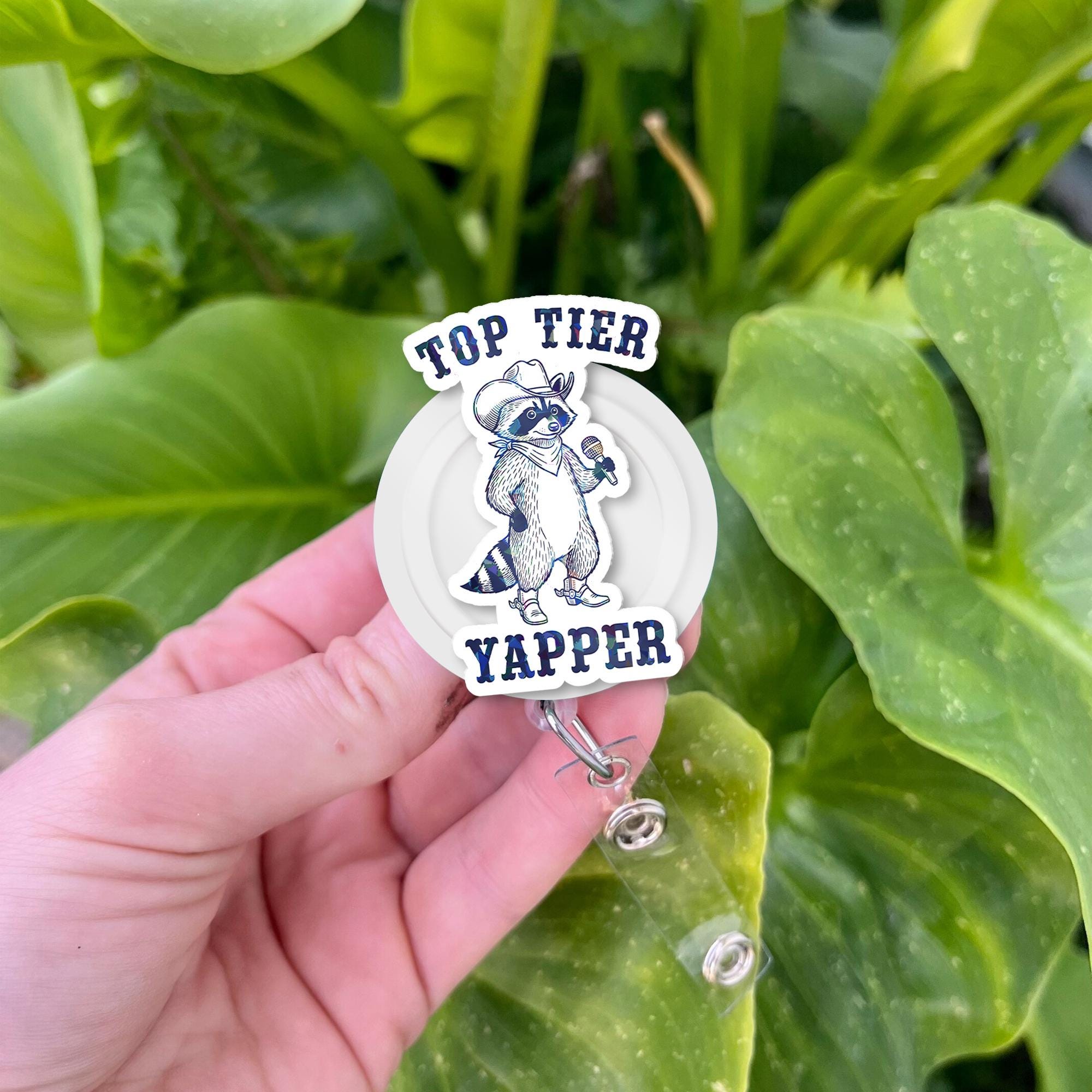 Top Tier Yapper Badge Reel – Funny Raccoon Retractable ID Holder, Humorous Work Accessory for Nurses, Office, or Customer Service