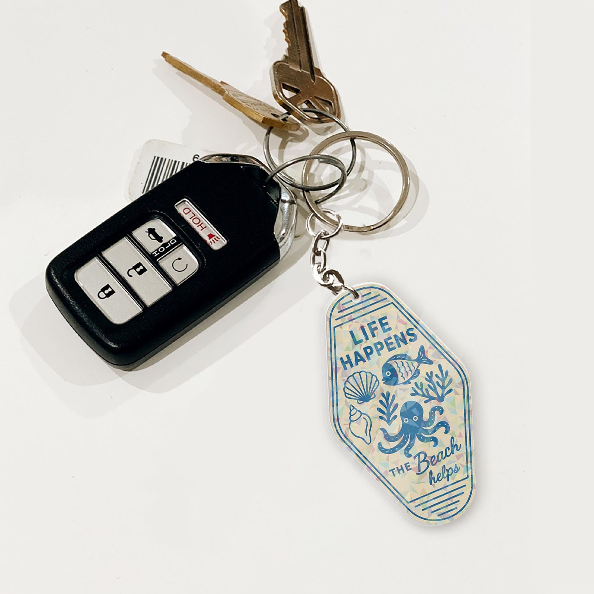 Life Happens the Beach Helps Holographic Keychain – Retro Motel Tag Style, Ocean Lover Summer Gift, Coastal Travel Bag Charm