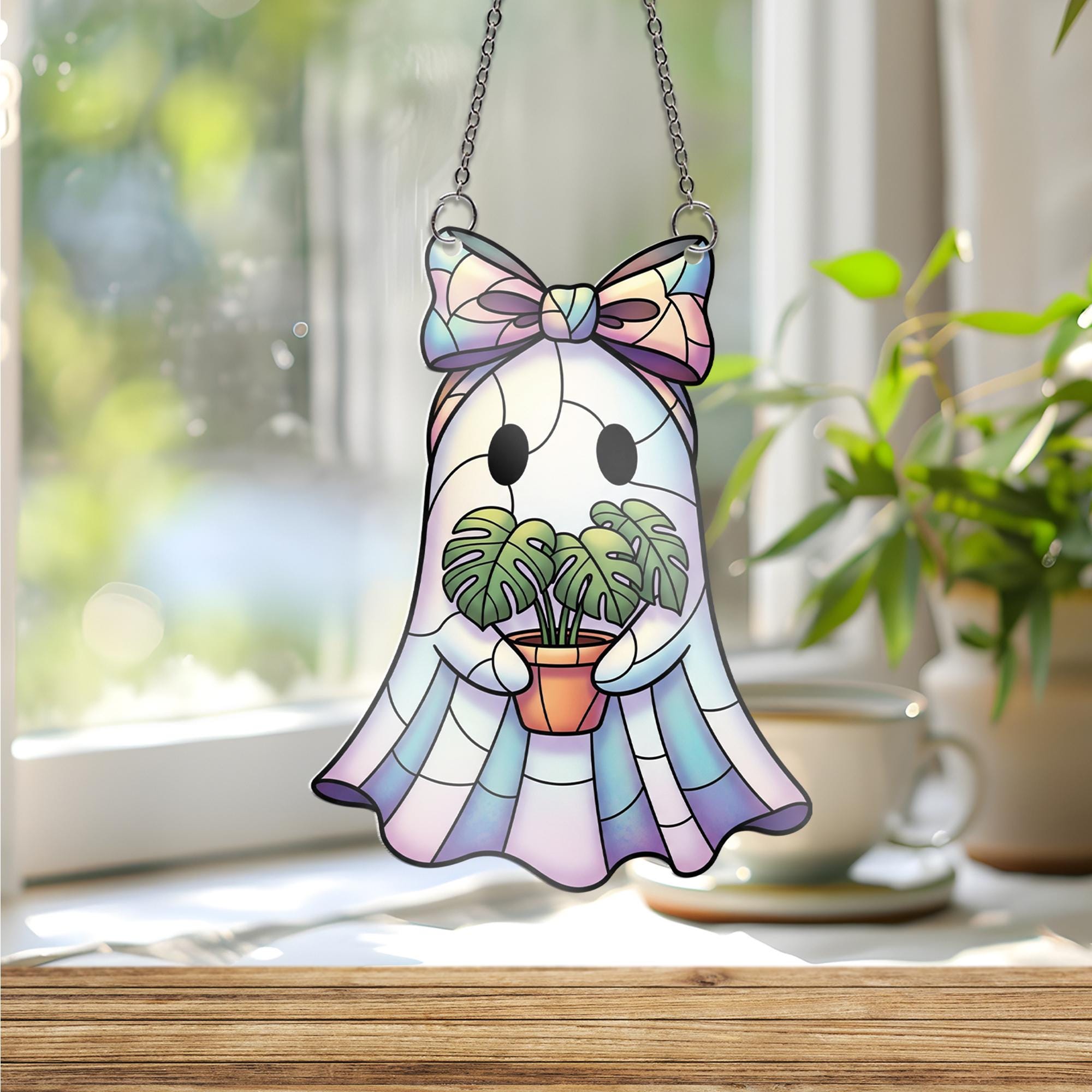 Iridescent Ghost Window Hanging – Faux Stained Glass Plant Lover Decor, Kawaii Spooky Suncatcher with Monstera and Pastel Bow