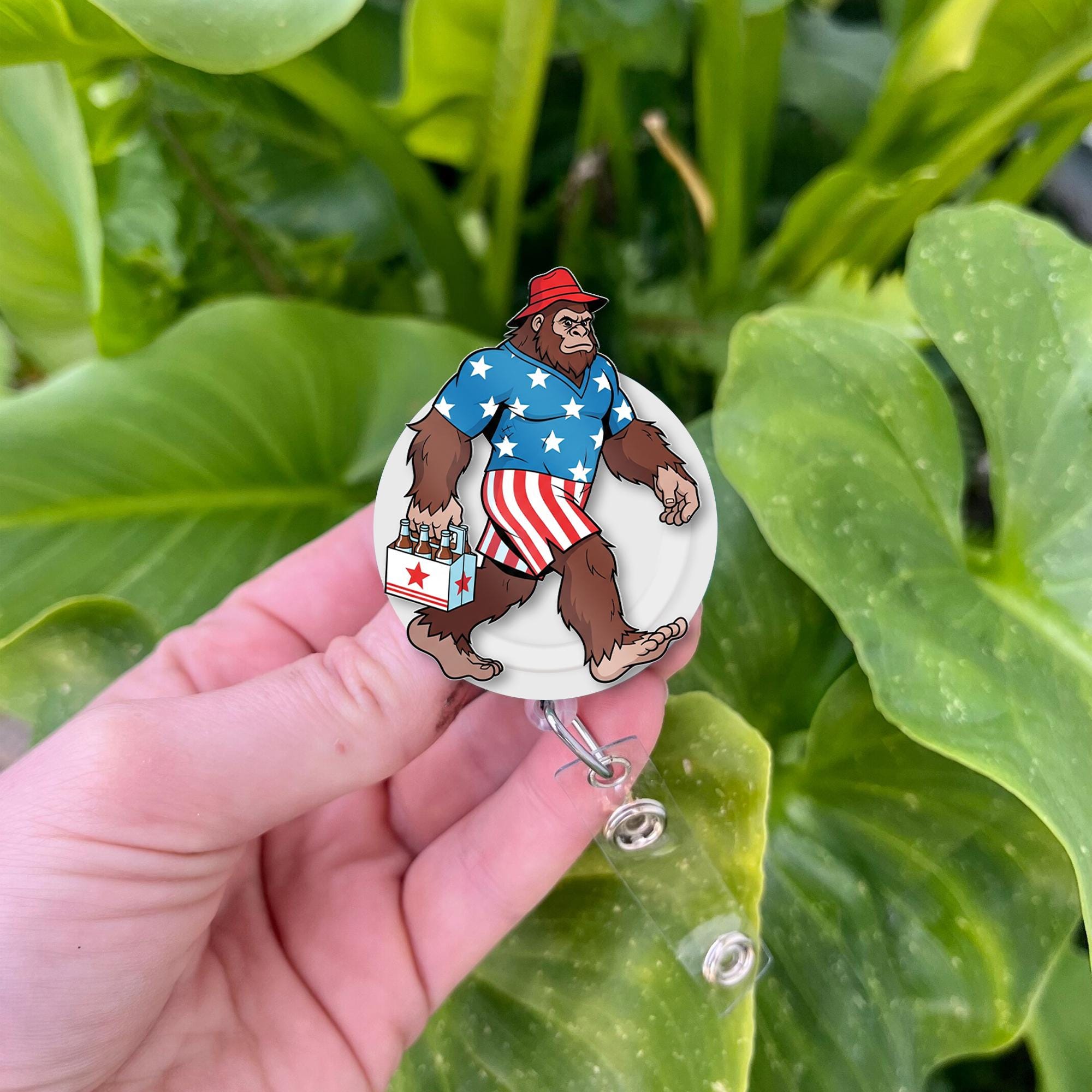 Patriotic Bigfoot Badge Reel – Funny 4th of July Sasquatch ID Holder – USA Summer Outfit Clip – Nurse Teacher Office Accessory
