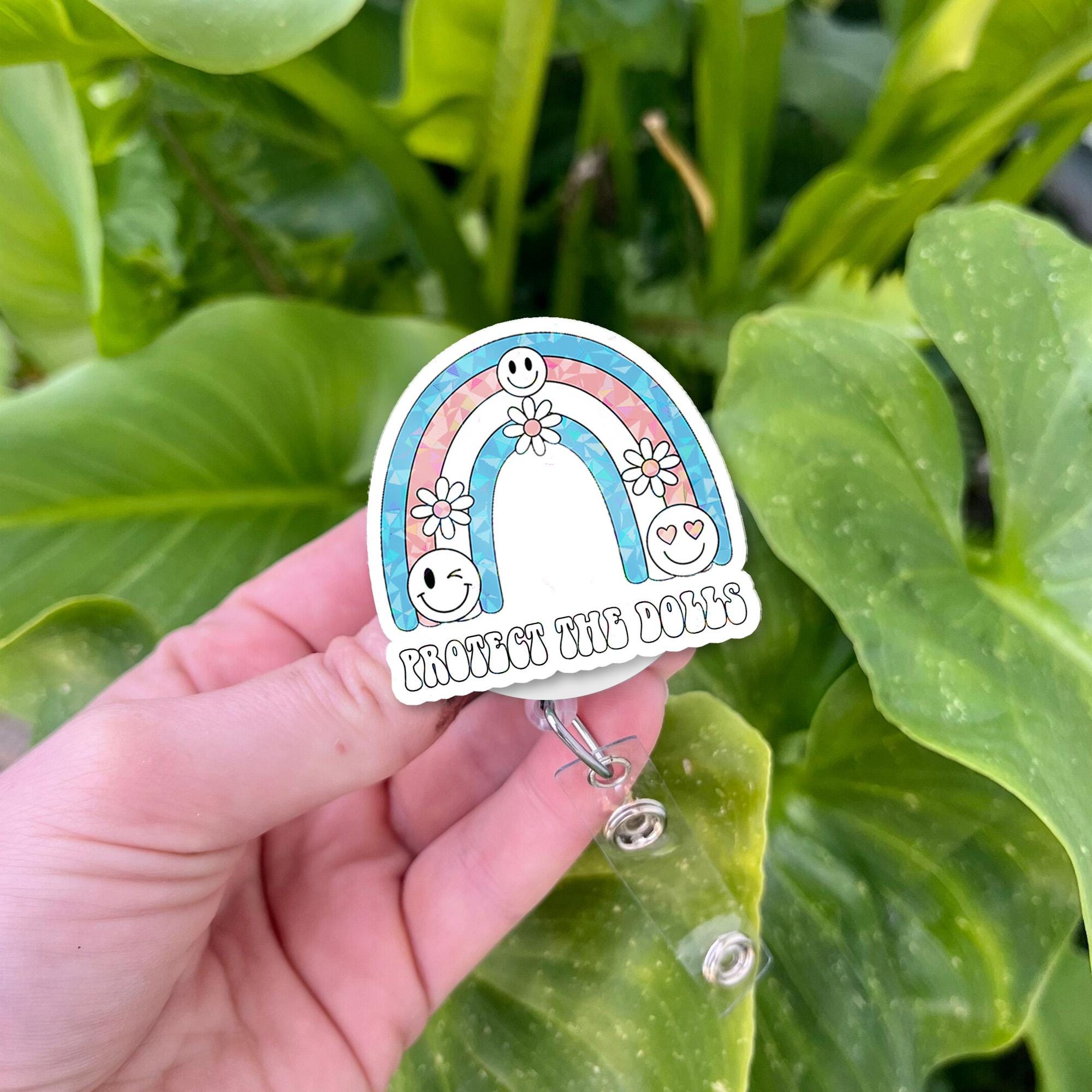 Protect the Dolls Badge Reel – Trans Flag Rainbow ID Clip – Cute Pride Work Badge – Inclusive LGBTQ Retractable Holder
