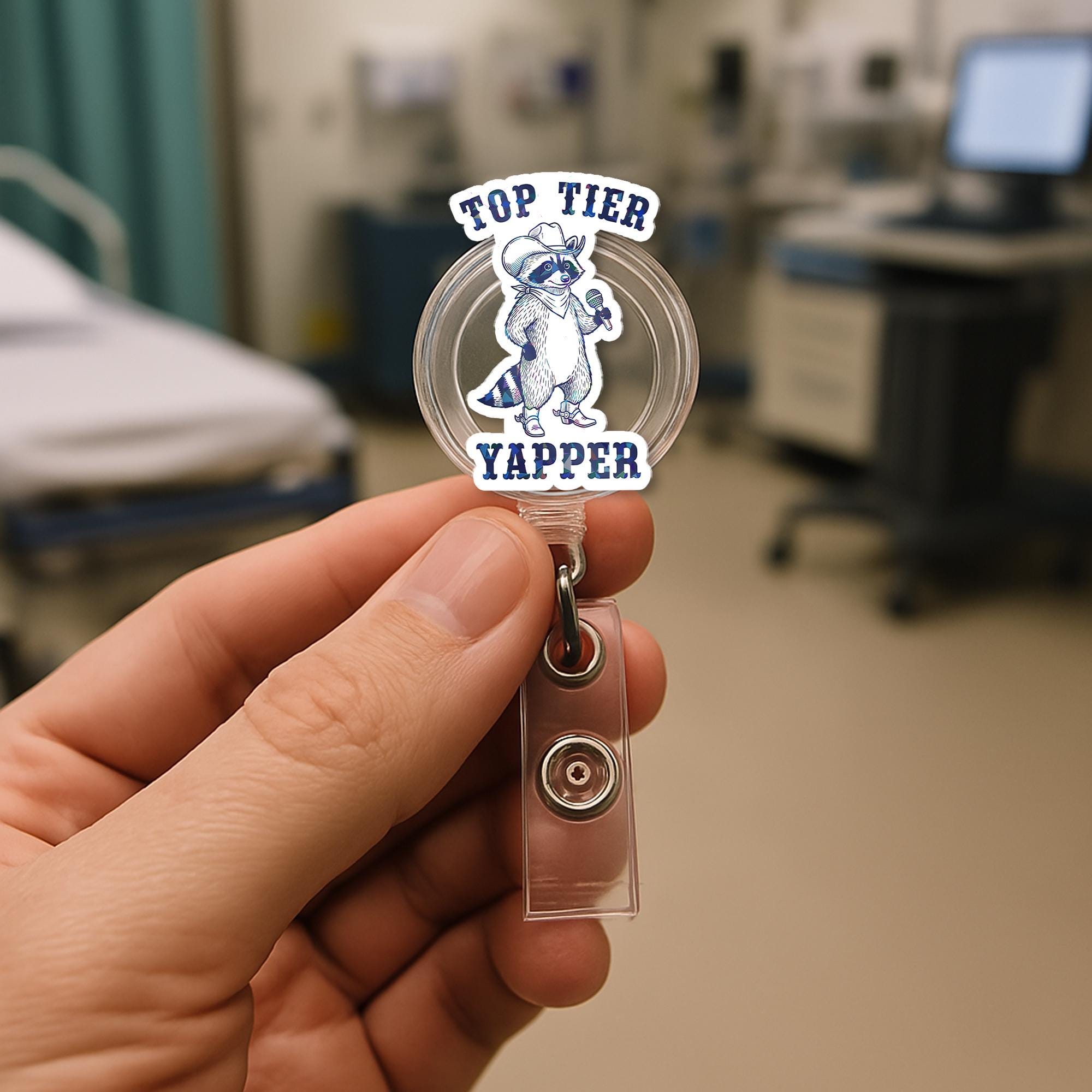 Top Tier Yapper Badge Reel – Funny Raccoon Retractable ID Holder, Humorous Work Accessory for Nurses, Office, or Customer Service