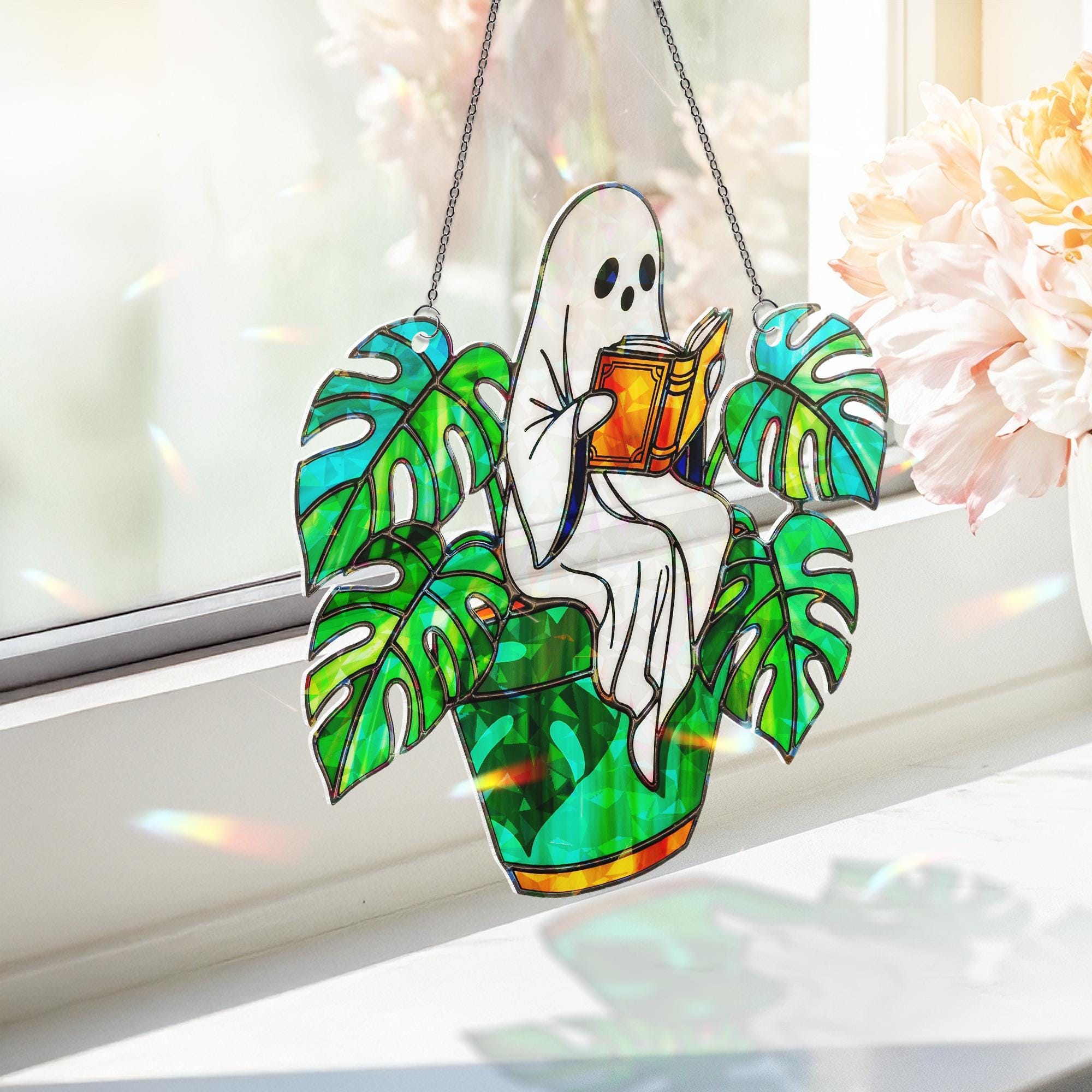 Ghost Plant Suncatcher – Holographic Acrylic Window Decor, Reading Ghost in Monstera Pot, Spooky Cottagecore Gift for Plant Lovers