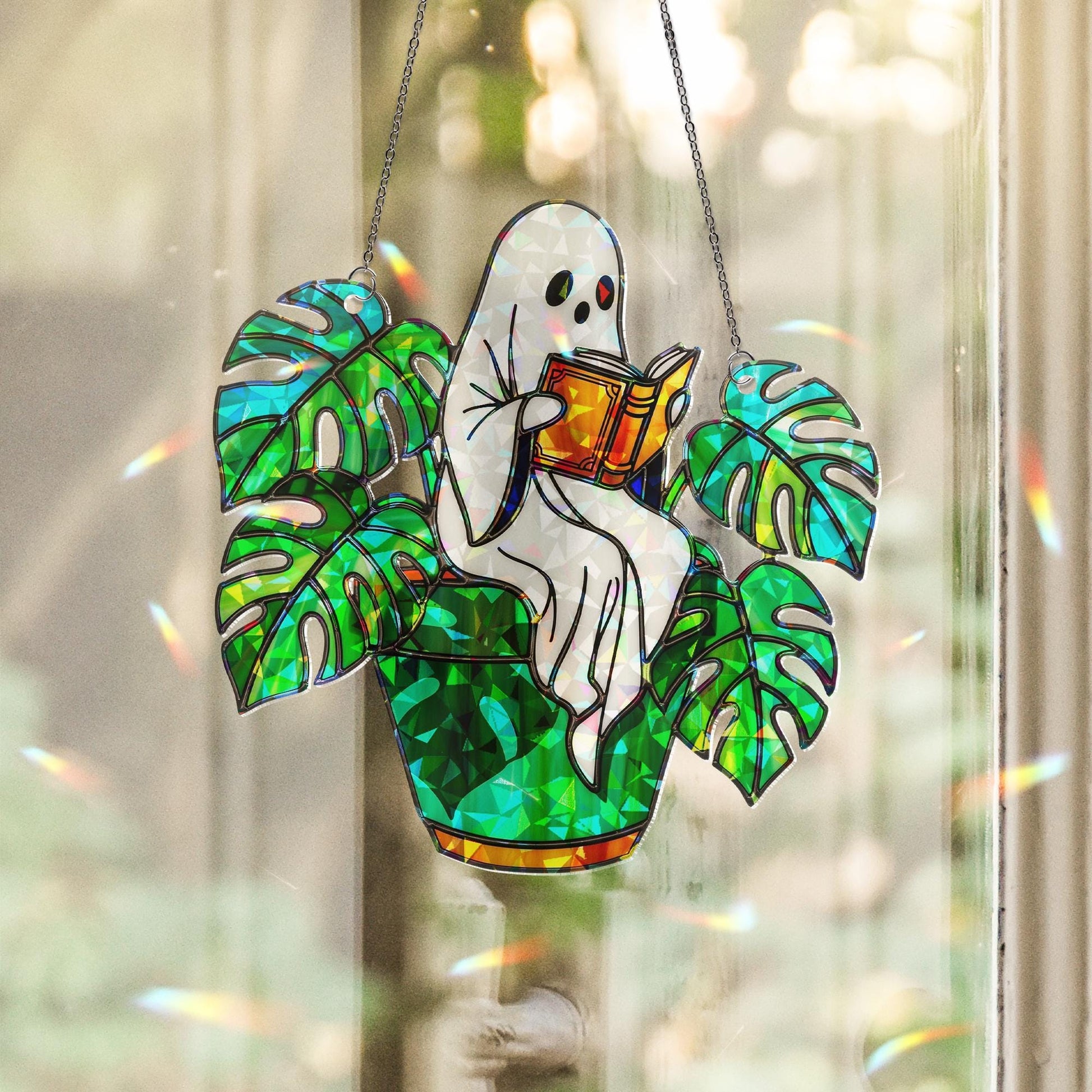 Ghost Plant Suncatcher – Holographic Acrylic Window Decor, Reading Ghost in Monstera Pot, Spooky Cottagecore Gift for Plant Lovers