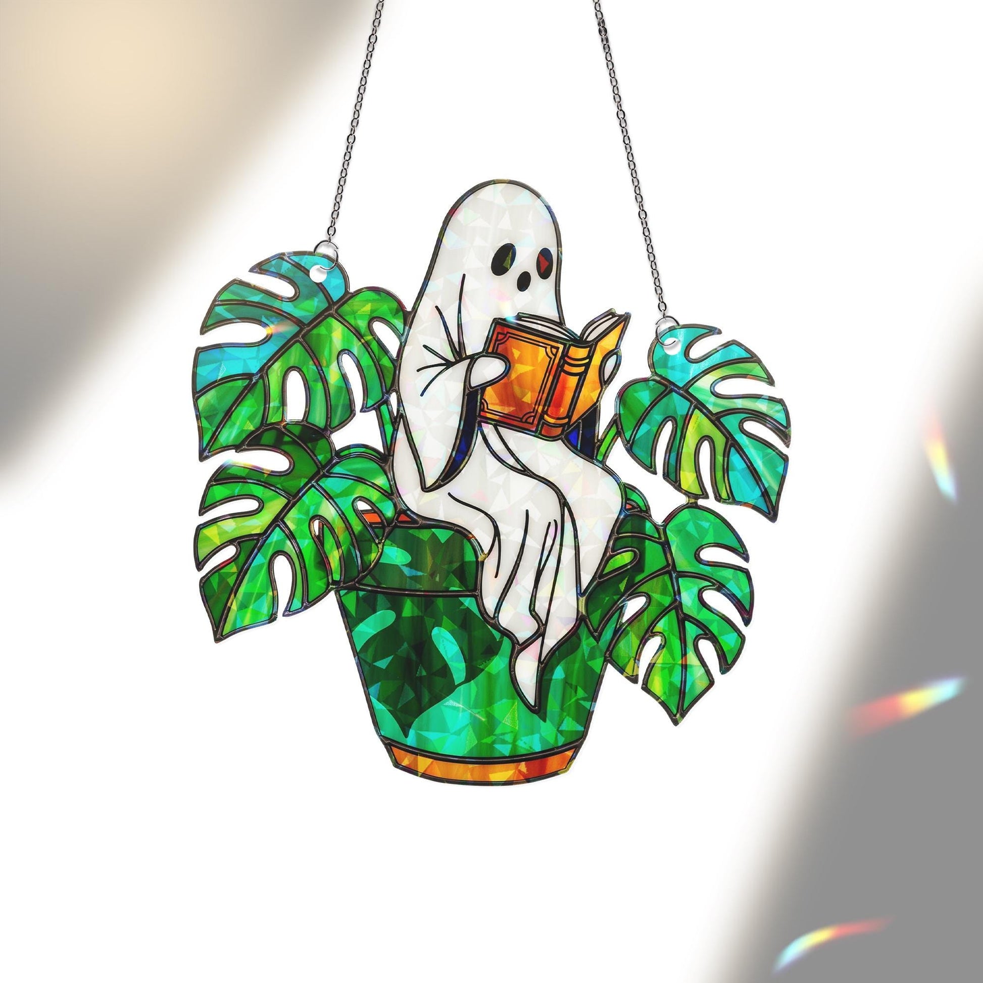 Ghost Plant Suncatcher – Holographic Acrylic Window Decor, Reading Ghost in Monstera Pot, Spooky Cottagecore Gift for Plant Lovers
