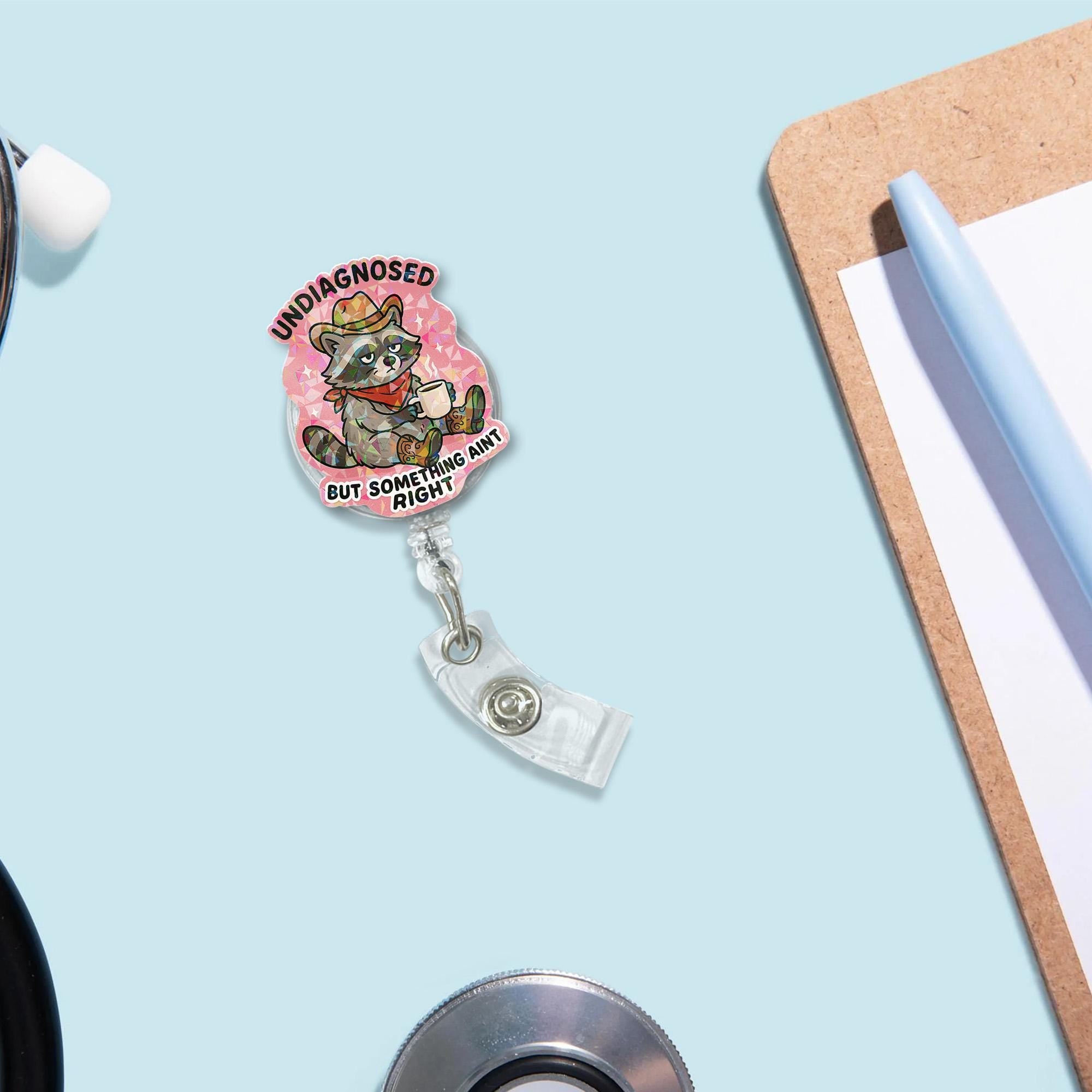 Funny Holographic Badge Reel – “Undiagnosed but Something Ain’t Right” Raccoon ID Holder–Mental Health Humor for Nurses, Teachers, or Office