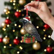 Raven Christmas Ornament – Acrylic Hanging Decoration with Santa Hat and Gift Box Design