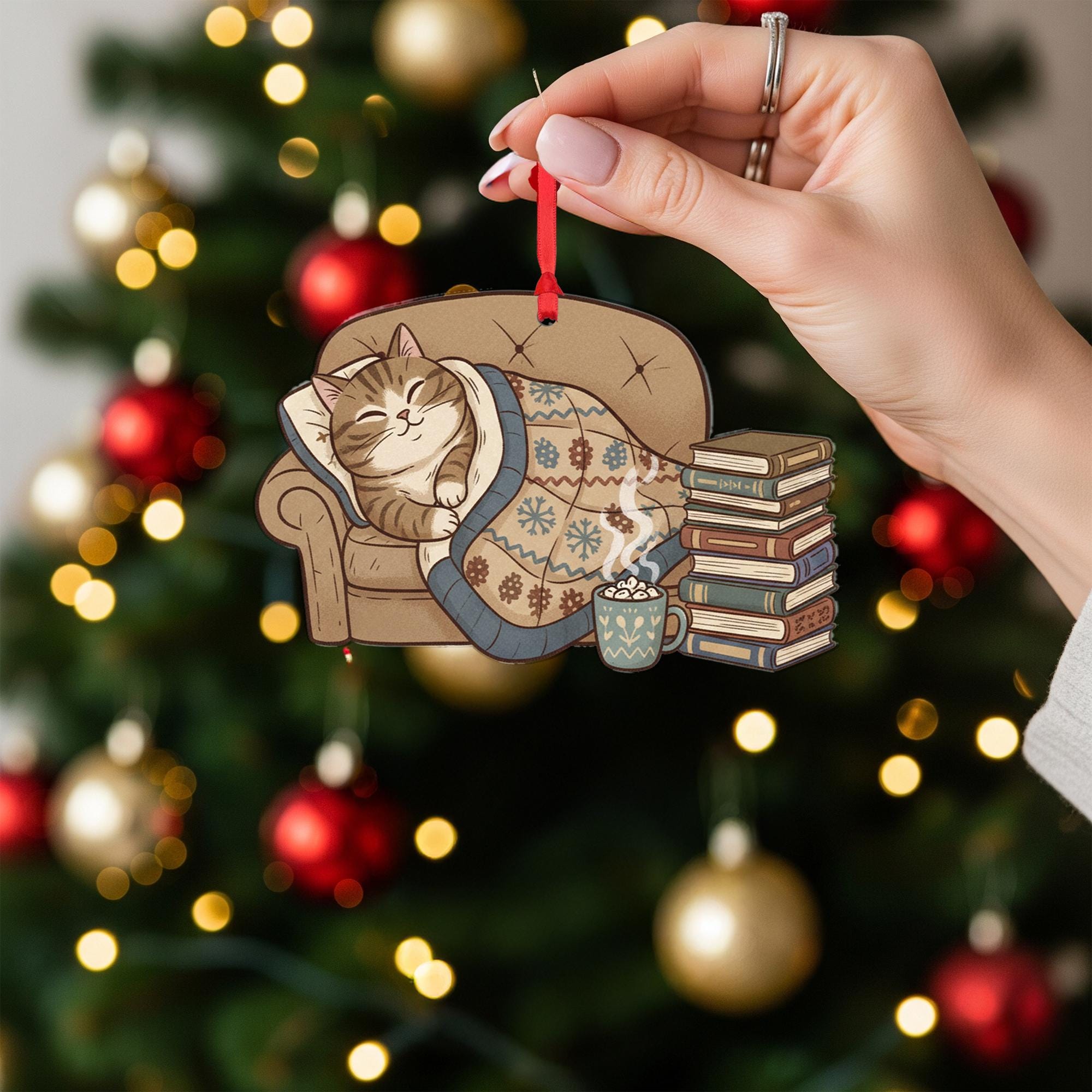 Cat Ornament on Sofa with Blanket and Books, Cozy Christmas Decoration with Hot Cocoa