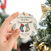 Personalized Ceramic Ornament – First Christmas Married with Stockings and Greenery