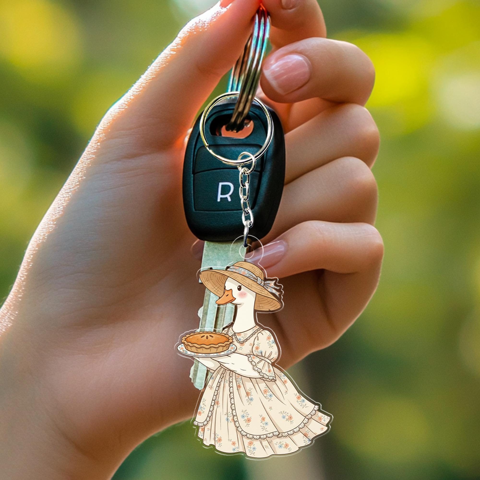 Acrylic Goose Keychain – Cartoon Animal in Dress Holding Pie